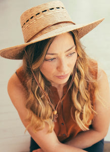 handmade hat woven with palm on woman
