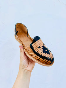 tan and black womans sandal